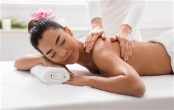 relaxed-asian-woman-pampering-herself-with-body-ma-2022-02-01-22-39-44-utc