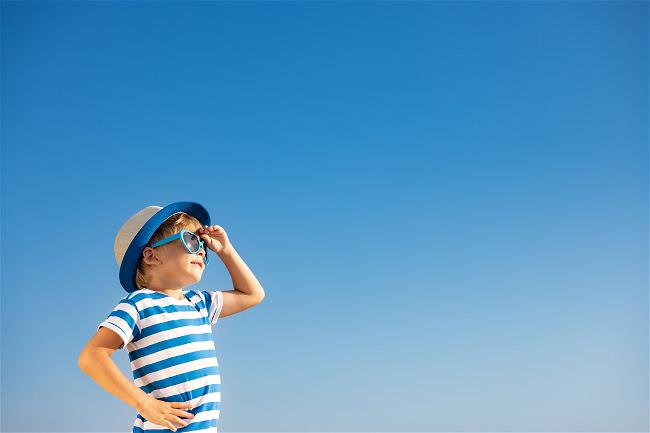 happy-child-having-fun-outdoor-against-blue-sky-2022-01-10-15-46-11-utc